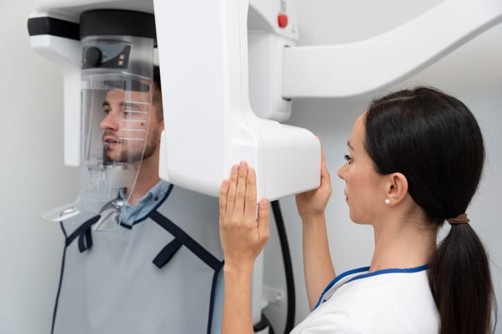 Dental team member preparing imaging for a patient